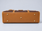 Modern Work Tote bottom view in red wine with tan leather base, five gold-tone protective metal feet and structured rectangular design