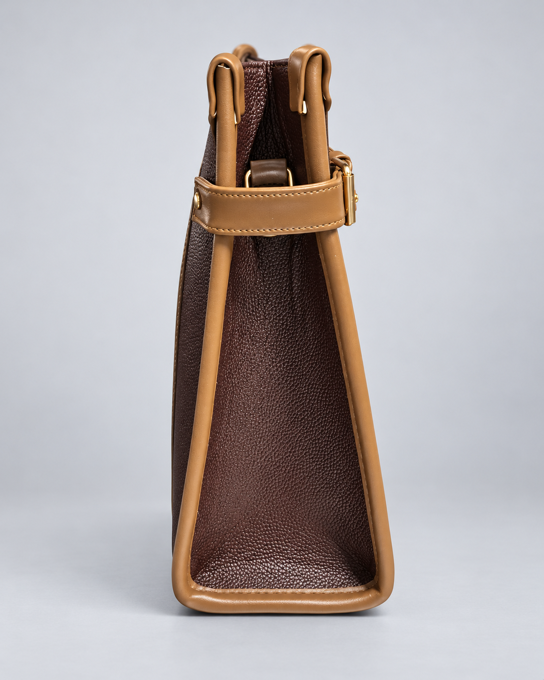 Modern Work Tote side profile in red wine with tan leather trim, structured triangular side panel, adjustable side strap and gold-tone hardware