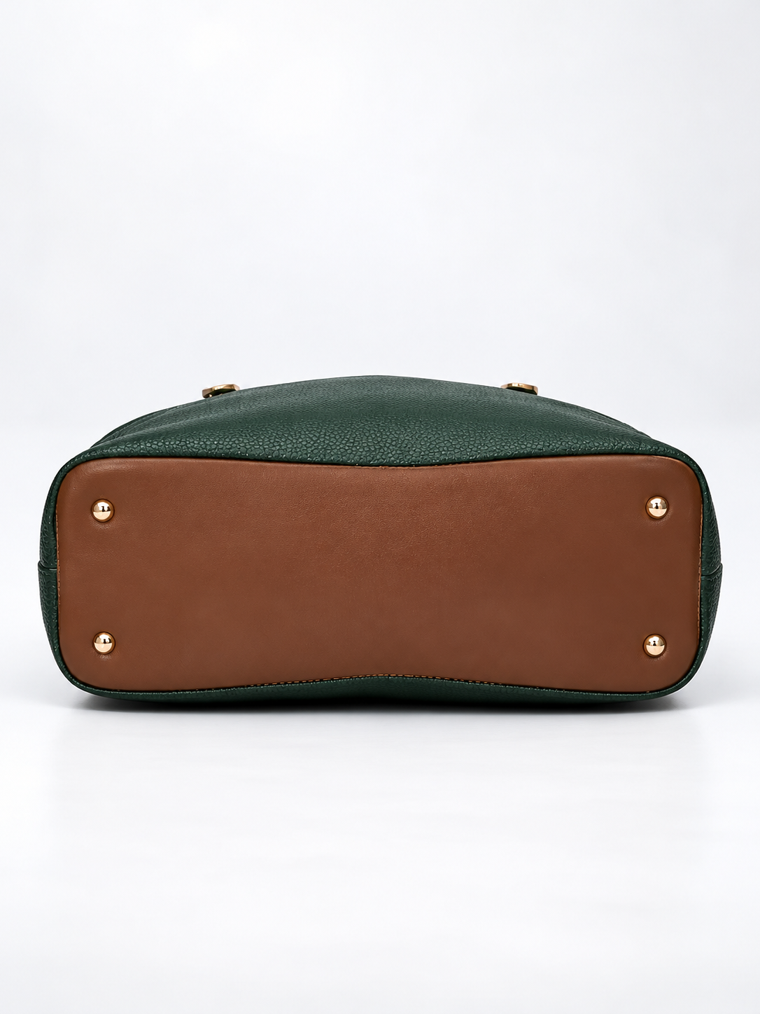 Modern Hola Shoulder Bag bottom view in forest green featuring a brown base panel, four gold-tone protective feet and pebbled PU leather edges