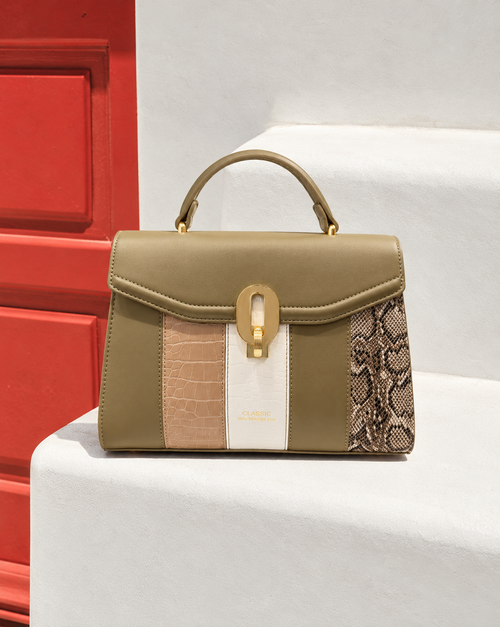 Bela Sling front view in olive green with textured panels, snakeskin detailing and gold-tone clasp | variant:green