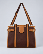 Modern Work Tote front view in red wine with tan leather trim, detachable shoulder strap, dual vertical straps and gold-tone buckle hardware