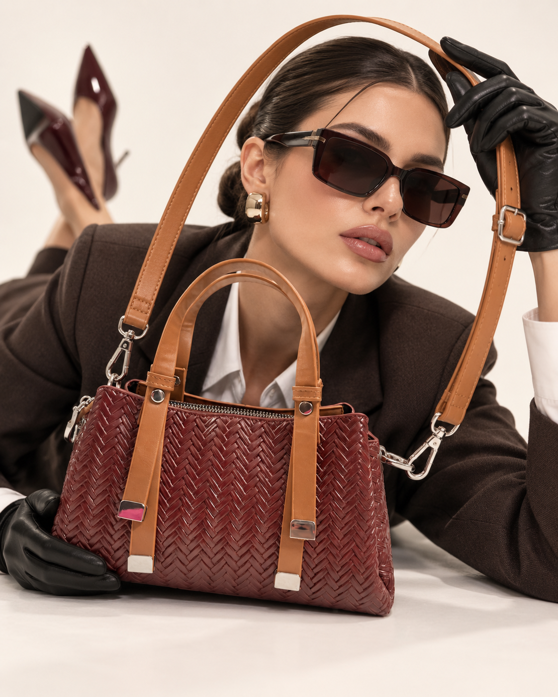 Modern Braid sling bag lifestyle shot with model in red